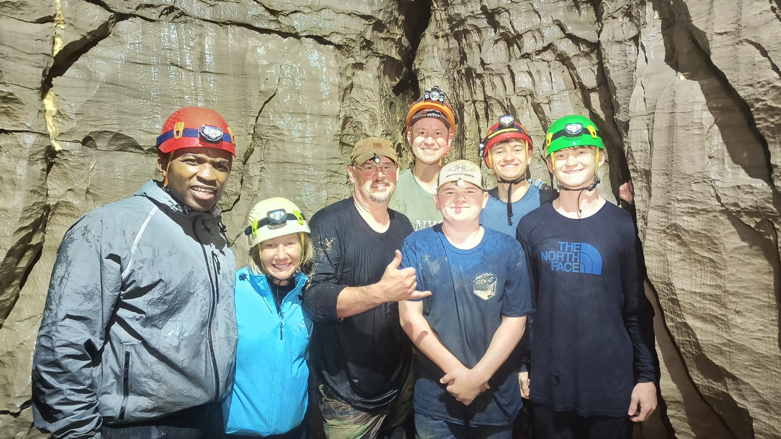 Scout Group in a cave adventure waterfall